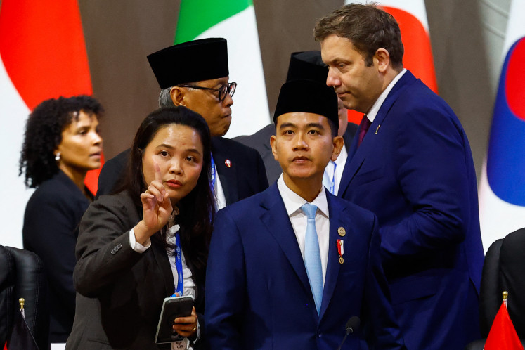 Takes the stage: Indonesia’s Vice President Gibran Rakabuming Raka (front, right) and German Finance Minister and Vice Chan- cellor Lars Klingbeil (center, right) arrive on Saturday, Nov. 22, to attend a G20 Leaders’ Summit plenary session at the Nasrec Expo Centre in Johannesburg, South Africa.