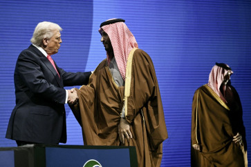 US President Donald Trump shakes hands with Crown Prince and Prime Minister of the Kingdom of Saudi Arabia Mohammed bin Salman at the US-Saudi Investment Forum at the John F. Kennedy Center for the Performing Arts in Washington, DC on Nov. 19, 2025.