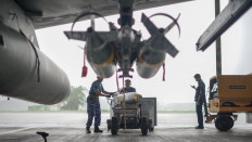 Air Force armorers load BNT-250 live bombs onto an F-16 AM from the 3rd Air Squadron at the Iswahjudi Air Force Base in Maospati, Magetan regency, East Java, on Nov. 18, 2025. The NATO-standard bomb is locally made by private arms maker PT Sari Bahari in cooperation with state-owned explosives maker PT Dahana. 