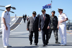 President Prabowo Subianto (second left) and Australian Prime Minister Anthony Albanese (center) walk on the deck of Fleet Flagship HMAS Canberra on Nov. 12, 2025, during a visit to HMAS Kuttabul, the Royal Australian Navy’s Fleet Base East in Sydney. 