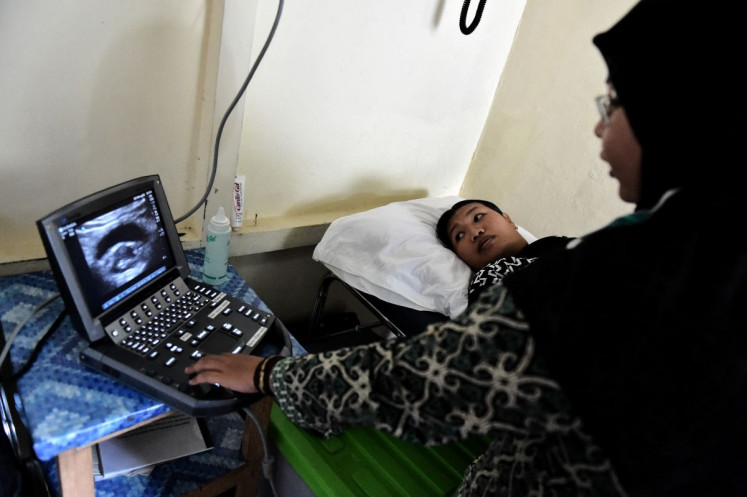 Baby in waiting: A gynaecologist performs an ultrasound on a pregnant woman on Aug. 3, 2025 at a non-profit health clinic in Sukadana, West Kalimantan.