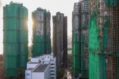 Charred remains of multiple residential towers following a deadly fire on Wednesday at Wang Fuk Court housing complex in Tai Po, Hong Kong, on Nov. 29, 2025.