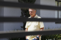 Former Brazilian President Jair Bolsonaro gestures from his residence in Brasilia, Brazil on Sept. 3, 2025.