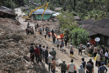 Rescue teams work in a search and rescueoperation in an area hit by deadly landslides following heavy rains in Sibalanga, North Tapanuli, North Sumatra, on Nov. 29, 2025.