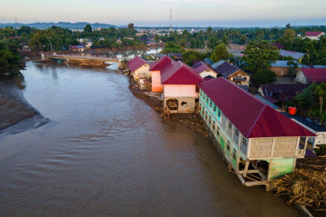 An aerial view shows flood damage to a school in Meureudu, Pidie Jaya district in Aceh province on November 30, 2025. 