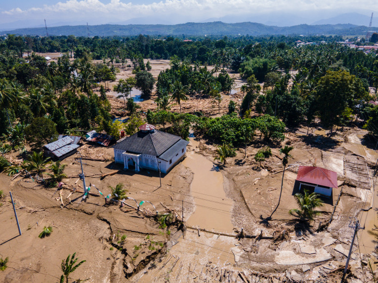 A mosque stands after flash floods on Sunday in Meureudu, Pidie Jaya district in Aceh.
