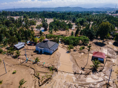 A mosque stands after flash floods on Sunday in Meureudu, Pidie Jaya district in Aceh.
