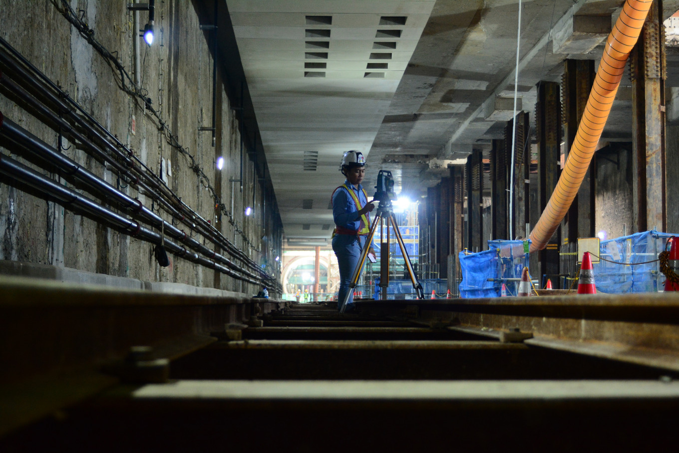 A surveyor inspects a construction site in Central Jakarta on Nov. 27, 2025, part of contract package (CP) 202 in Phase 2A of the MRT Jakarta project.