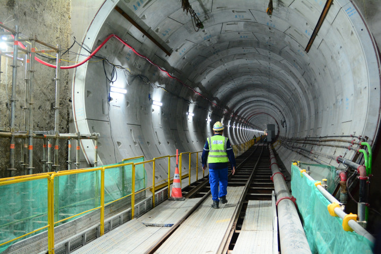 Workers walk at the construction site of the Jakarta MRT Phase 2A CP202 project in Jakarta, on Thursday, Nov. 27. Construction of the Sawah Besar Station, which adopts a transit-oriented development (TOD) concept, has reached 60.2 percent and is targeted for completion and operation in 2029. 