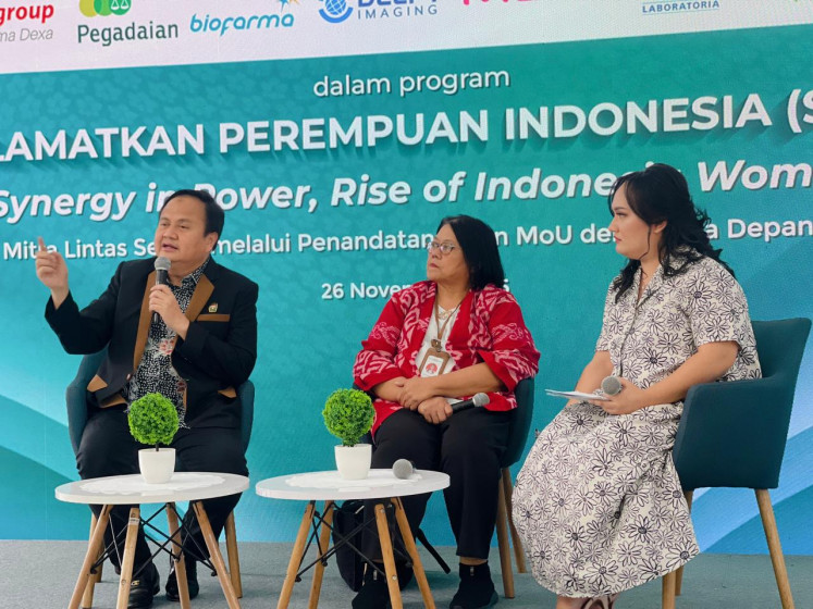 The Indonesian Obstetrician and Gynecology Society (POGI) chairman Budi Wiweko (left) talks about the importance of improving Indonesian women's health on Thursday, next to Women's Empowerment and Children Protection Ministry special staff Siti Nia Nurhasanah Sjarifudin (center) and the moderator, in Jakarta. POGI launched the Save Indonesian Women (SPRIN) movement to help increase health services for women and reduce Indonesia's maternal mortality ratio. 