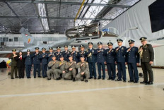 Indonesian Air Force deputy chief of staff Air Marshal Tedi Rizalihadi (eighth right) poses with other officers in front of a two-seater Dassault Rafale B on Nov. 28, 2025, along with the four pilots (front) training to operate the fighter jet, during an acceptance ceremony at Dassault Aviation’s Merignac facility of in Bordeaux, France.