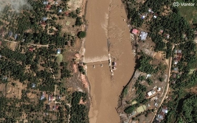 This handout satellite image by Vantor received on December 2, 2025 shows a view of flood damage in the Peusangan river and weir in Bireuen, Aceh Province on December on November 30, 2025. 