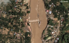 This handout satellite image by Vantor received on December 2, 2025 shows a view of flood damage in the Peusangan river and weir in Bireuen, Aceh Province on December on November 30, 2025. 