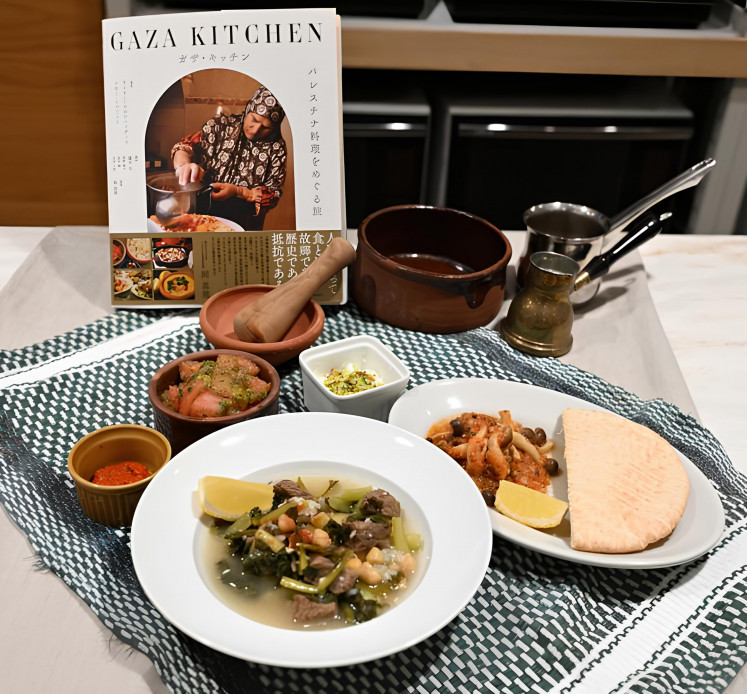 Taste of culture: Fogaiyya stew (front) and other dishes are served at an event commemorating the Japanese publication of 'The Gaza Kitchen: A Palestinian Culinary Journey' at Koto Laboratory in Tokyo in October.