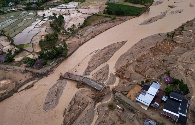 An aerial photo shows damage left by a flash flood on Dec. 2 in Rigeb, Blangkejeren, Gayo Lues regency, Aceh.