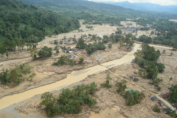 A village is seen from above on Dec. 2 following a flash flood in Batang Toru district, South Tapanuli regency, North Sumatra.