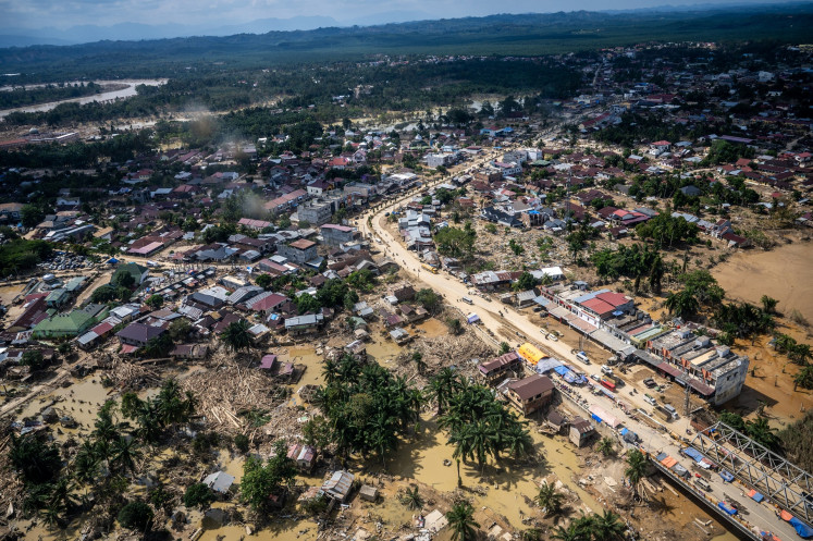 An aerial photo shows Aceh Tamiang regency in Aceh on Dec. 4, 2025, one week after floods and landslides triggered by Tropical Cyclone Senyar made landfall on the northern part of Sumatra. Nearly 1.5 million people across 3,310 villages in Aceh province are affected by the disasters, according to official estimates.