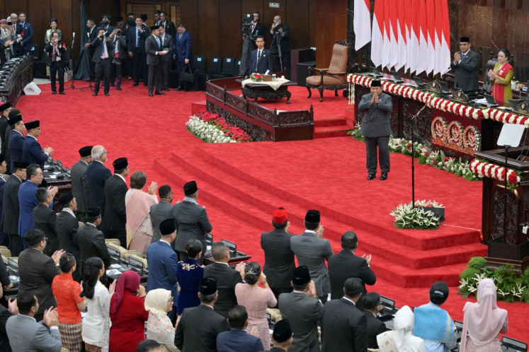 Debut delivery: President Prabowo Subianto makes a gesture of greeting to members of the People’s Consultative Assembly (MPR) on Aug. 15, 2025, as he mounts the stage to delivers his first State of the Nation Address at the Senayan Legislative Complex in Central Jakarta.