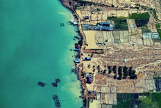 A residential area is seen damaged after flash floods in Bener Meriah district, Aceh province on December 4, 2025. 