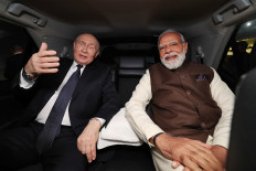 India's Prime Minister Narendra Modi (right) and Russia's President Vladimir Putin sit in a car, on Dec. 4, 2025, departing from Palam Air Force Base, India. Putin arrived in India on Dec. 4 for a two-day visit aimed at deepening defense ties, as New Delhi faces heavy United States pressure to stop buying oil from Moscow.