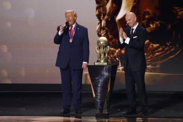 World soccer body FIFA president Gianni Infantino (right) presents United States President Donald Trump with the FIFA Peace Prize during the FIFA World Cup 2026 Final Draw at John F. Kennedy Center for the Performing Arts in Washington, DC, the United States on Dec. 5, 2025.