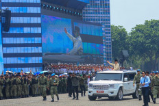 President Prabowo Subianto greets and inspects troops from his presidential vehicle on Oct. 5, 2025, ahead of a ceremony to celebrate the 80th anniversary of the Indonesian Military at the National Monument (Monas) complex in Central Jakarta.