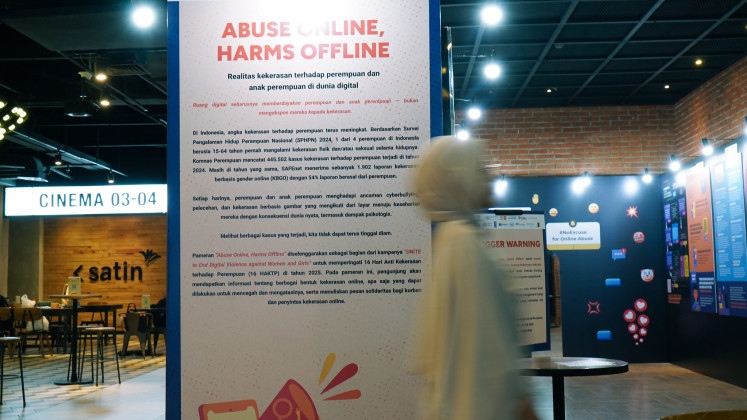 A woman walks in front of a poster on gender-based violence on Friday at CGV FX Sudirman in Jakarta. United Nations Women, UN Population Fund (UNFPA) and the Women's Empowerment and Child Protection Ministry held the UNiTE 2025 Film Screening and Discussion on Friday as part of the 16 Days of Activism against Gender-Based Violence campaign aimed to strengthen collective action to end violence against women and girls.