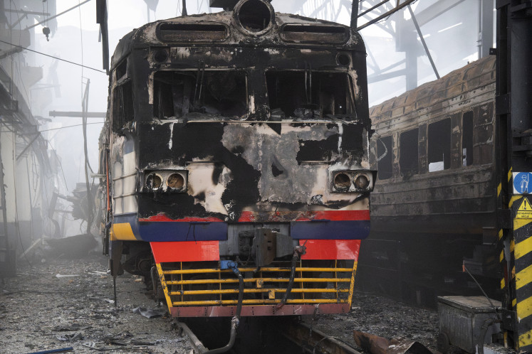 Charred electric trains are seen in a damaged depot in the town of Fastiv, Kyiv region after an air attack on December 6, 2025, amid the Russian invasion of Ukraine.