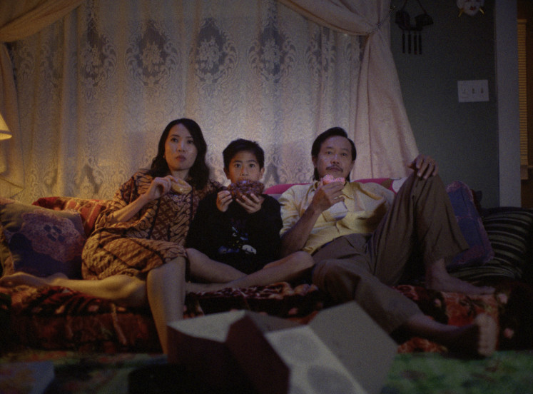 Family frame: Bastian (Jett Automo) sits between his mother Eliawati (Michelle Lukiman) and father Heruawan (Kaidy Kuna), in this still from the autobiographical short movie 'Daly City’ by New York-based director Hartanto, who cast Indonesian diaspora actors in the lead roles.