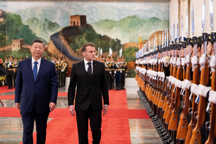Official welcoming ceremony for French President Emmanuel Macron by China's President Xi Jinping in the Great Hall of the People in Beijing on Dec. 4, 2025.