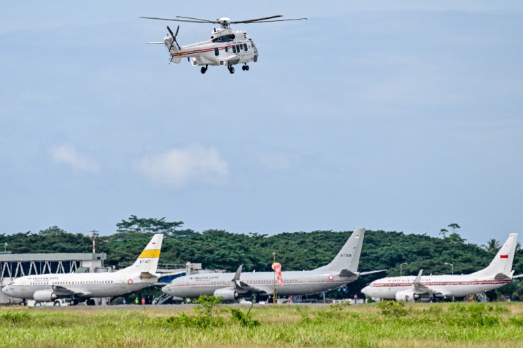 A chopper carrying President Prabowo Subianto inspects flood affected areas in Blang Bintang, Aceh province on December 7, 2025. 