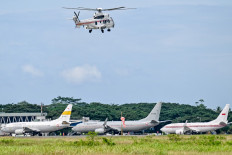 A chopper carrying President Prabowo Subianto inspects flood affected areas in Blang Bintang, Aceh province on December 7, 2025. 