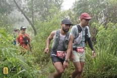 Runners participate in the 2024 Siksorogo Lawu Ultra trail race 