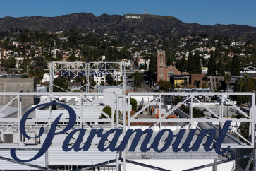 A drone view shows a sign for Paramount in front of the Hollywood sign in Los Angeles, California, US, on Dec. 8, 2025.