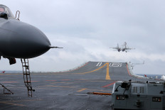 This photo taken on January 2, 2017 shows Chinese J-15 fighter jets being launched from the deck of the Liaoning aircraft carrier during military drills in the South China Sea.
