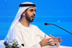 Omar al-Olama, UAE's Minister of State for Artificial Intelligence, Digital Economy and Remore Work, speaks during the Breaking Barriers 3: AI vs. EI - The Savior of Business conference at the Jaber al-Ahmad cultural center in Kuwait city on Nov. 16, 2025.