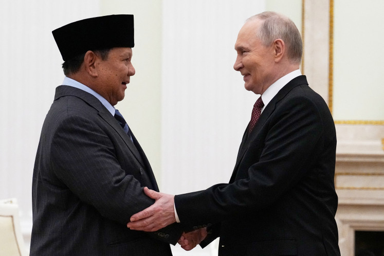 President Prabowo Subianto (left) and Russian President Vladimir Putin shake hands during their meeting at the Senate Palace of the Kremlin in Moscow on Dec. 10, 2025.