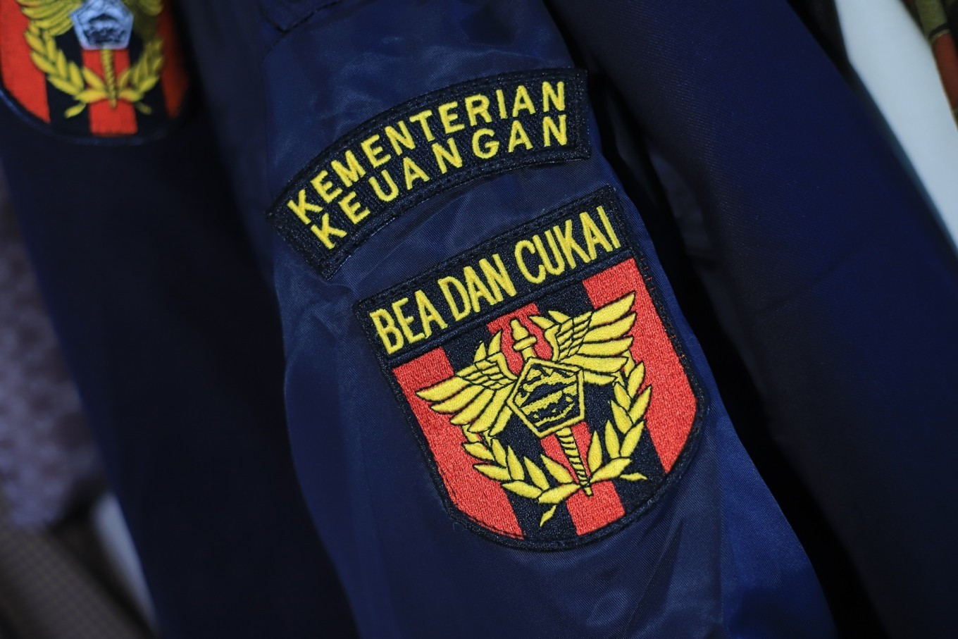 A sleeve patch featuring the logo of the Finance Ministry's customs and excise directorate general is seen in this stock photo taken on March 13, 2023. 