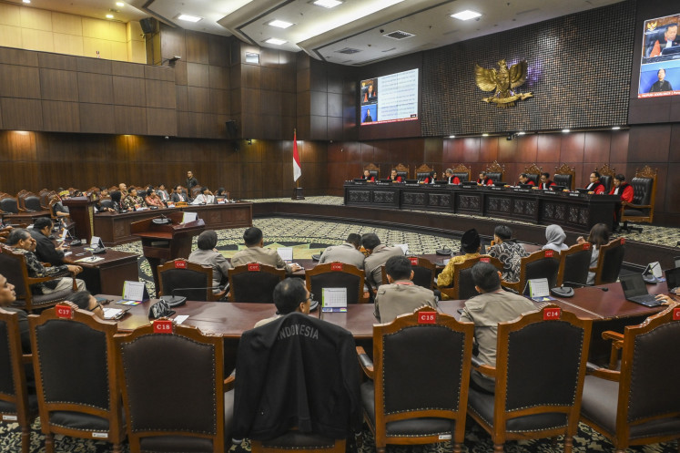 The hearing for a judicial review challenging the 2002 National Police Law is seen in session on Nov. 13, 2025, at the Constitutional Court building in Jakarta. Constitutional Court justices granted the petition and barred active police officers from holding additional government posts without retiring or resigning from the force.