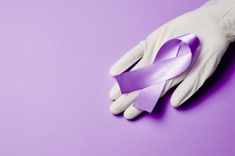 An illustration of purple ribbon that symbolizes World Leprosy Day, which is commemorated annually every last Sunday of January.
