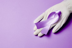 An illustration of purple ribbon that symbolizes World Leprosy Day, which is commemorated annually every last Sunday of January.