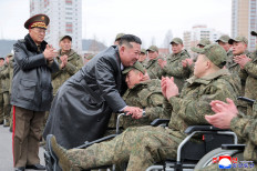 North Korean leader Kim Jong Un (third left) embraces a soldier during a welcoming ceremony at the April 25 Cultural and Tourism Center in Pyongyang, North Korea, on Dec. 12, 2025 for members of the 528th Engineer Regiment after they returned from an overseas mission.