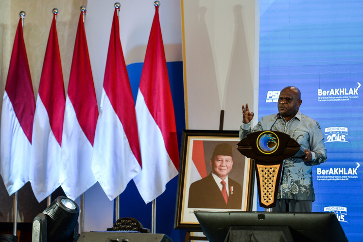 Human Rights Minister Natalius Pigai delivers a speech during the Human Rights Development Planning Meeting (Musrenbang) in Jakarta on Dec. 8, 2025.