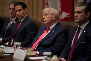 US President Donald Trump attends a meeting of his Cabinet alongside (left-right) US Interior Secretary Doug Burgum, Secretary of State Marco Rubio and Secretary of War Pete Hegseth in the Cabinet Room of the White House on December 02, 2025 in Washington, DC