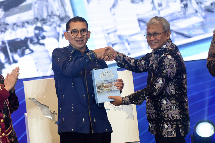 Indonesia&rsquo;s Culture Minister Fadli Zon (left) receives a copy of the book &ldquo;Sejarah Indonesia&rdquo; from Susanto Zuhdi, chairman of the Indonesian history rewriting team, during the soft launch of &ldquo;Sejarah Indonesia: Dinamika Kebangsaan dalam Arus Global&rdquo; on Dec. 14, 2025, at Plaza Insan Berprestasi, the Ministry of Primary and Secondary Education complex, in Jakarta. The Culture Ministry launched the book as a reference to help Indonesians recall the nation&rsquo;s collective historical memory.