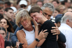 Sydney mourns: A woman cries as she pays her respects on Monday, Dec. 15, 2025, at Bondi Pavilion to victims of a shooting during a Jewish holiday celebration at Bondi Beach, in Sydney, Australia.