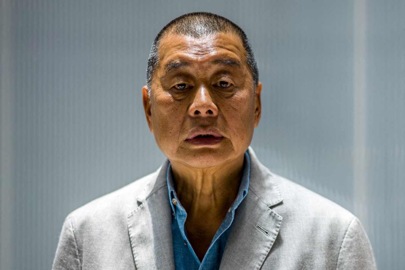 Millionaire media tycoon Jimmy Lai poses on June 16, 2020, during an interview with AFP at the Next Digital offices in Hong Kong, China. The United Kingdom condemned on Monday the &ldquo;politically motivated prosecution&rdquo; of Hong Kong media mogul Jimmy Lai, after he was found guilty on three charges in his national security trial.
