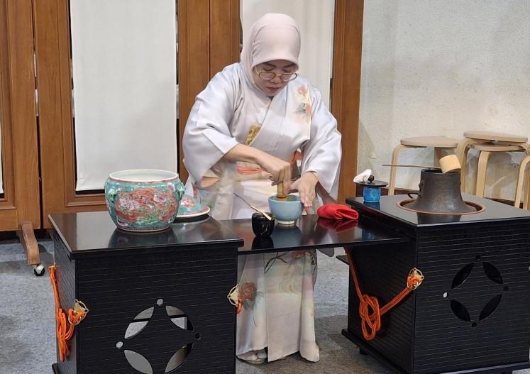 Mindful process: A hostess trained by Chado Urasenke Tankokai Indonesia Association prepares a bowl of matcha during a demonstration of chanoyu (Japanese traditional tea ceremony) during an event in December 2025, at the ASEAN Secretariat in Jakarta. 