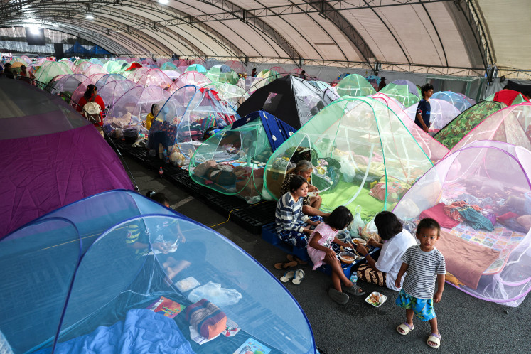 Give me shelter: Displaced people eat at a temporary shelter on Tuesday, Dec. 16, 2025, amid clashes between Thailand and Cambodia along a disputed border area, in Buriram province, Thailand.