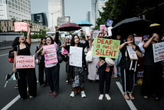 Participants march on March 8, 2025, during a protest organized by the Indonesian Women&rsquo;s Alliance (API) to mark the 50th International Women&rsquo;s Day demanding labor rights, gender equality and protections, in Central Jakarta.